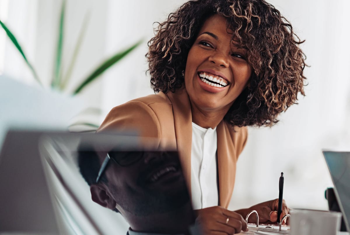 A client relationship director in conversation in a bright office
