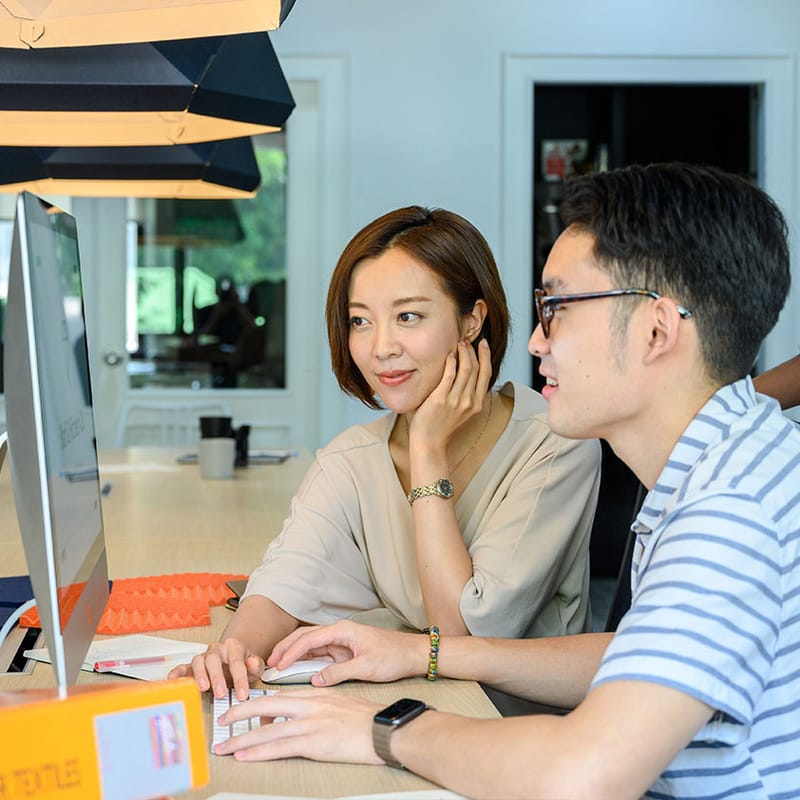 An eCommerce team working at a development and analytics workstation