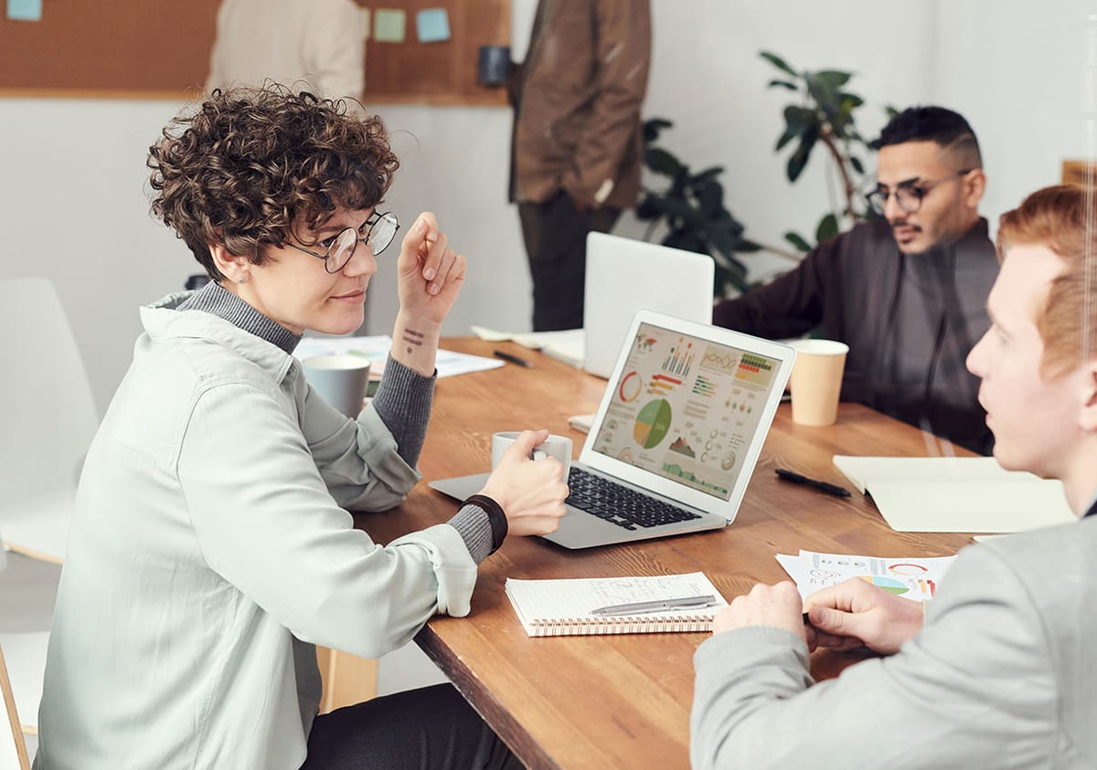 Advisers and a client working through a financial review